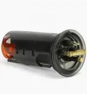 Black and orange automotive bulb holder with brass contacts.