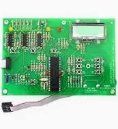 Green circuit board with various electronic components and LCD screen.