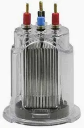 Clear plastic electrolysis cell with metal plates and three terminals: red, black, and blue.