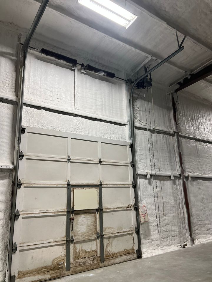 A garage door with a lot of insulation on it.