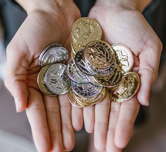 A Person Is Holding a Pile of Coins in Their Hands — Sunshine Coast Financial Advisers in Mooloolaba, QLD