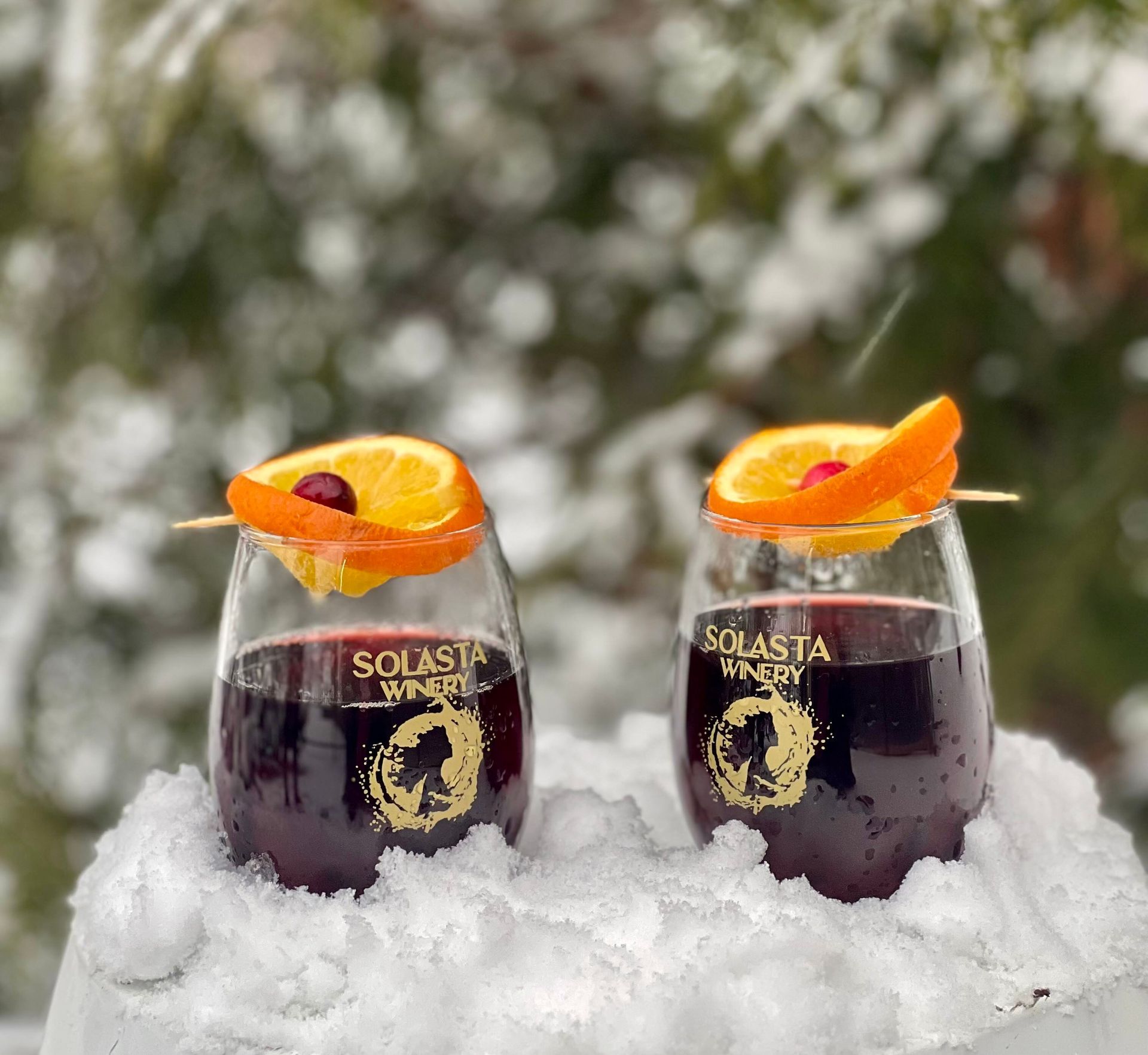 Two glasses of solasia energy are sitting in the snow
