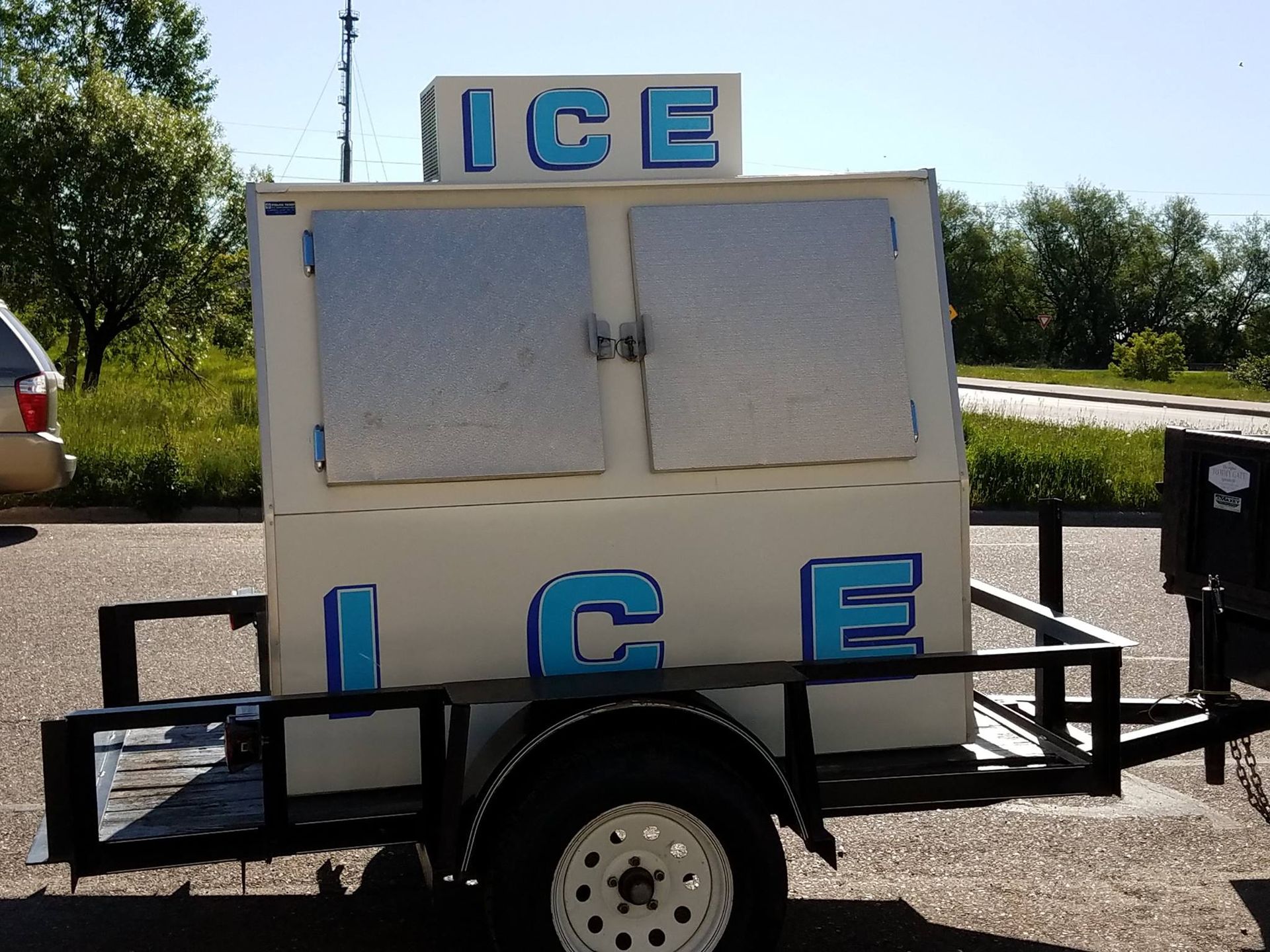 Ice vending machine on a trailer with blue 
