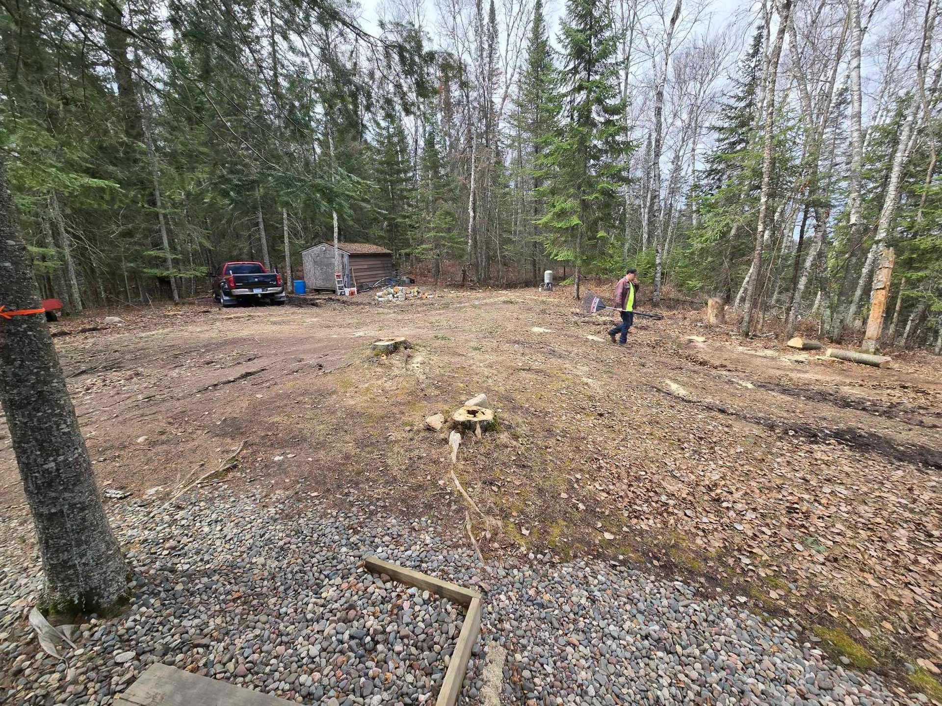 a man is using a chainsaw to cut a tree