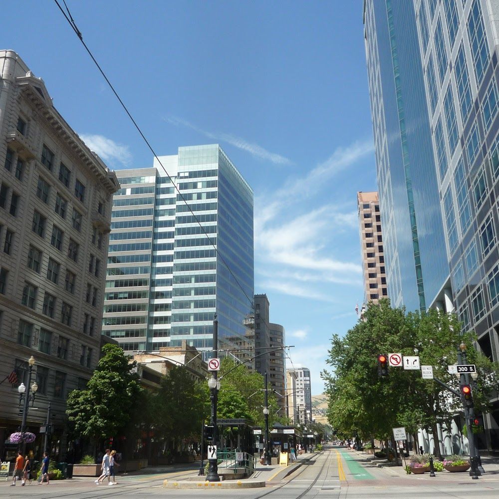 A busy city street with lots of tall buildings