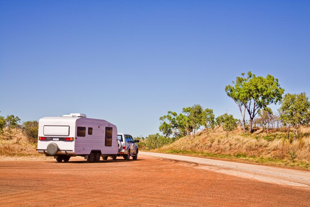 White Camper Trailer Pulled by Truck — The Caravan Clinic in Yamba, NSW