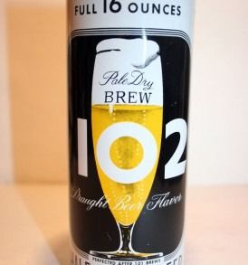 Black can of Iroquois Pale Dry Brew beer, 16 ounces, with a yellow foam-filled glass graphic