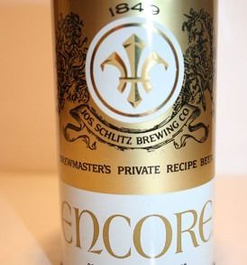 Close-up of an Encore beer can label with gold and black branding and Schlitz Brewing Co. seal