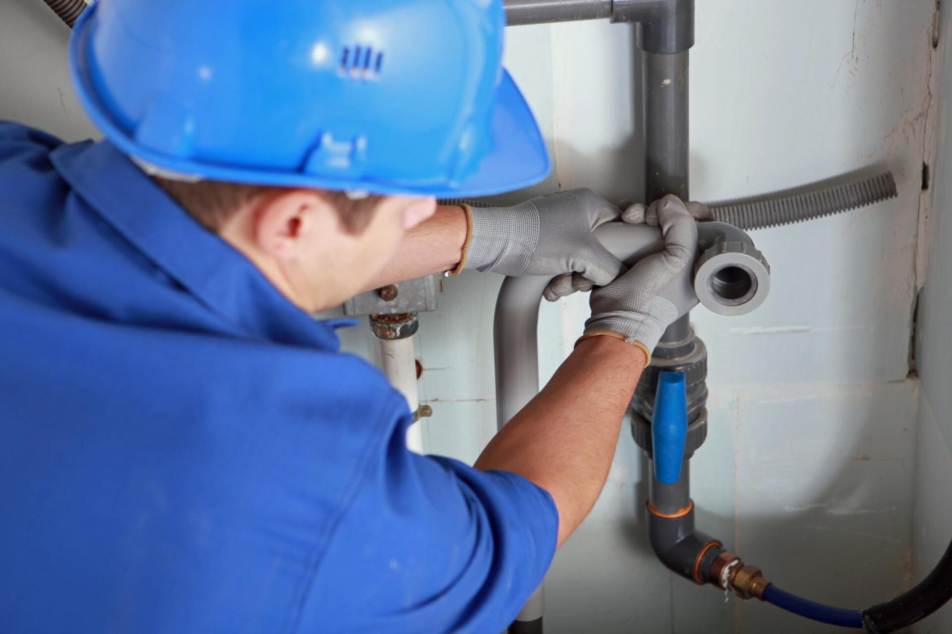 man repairing the pipe