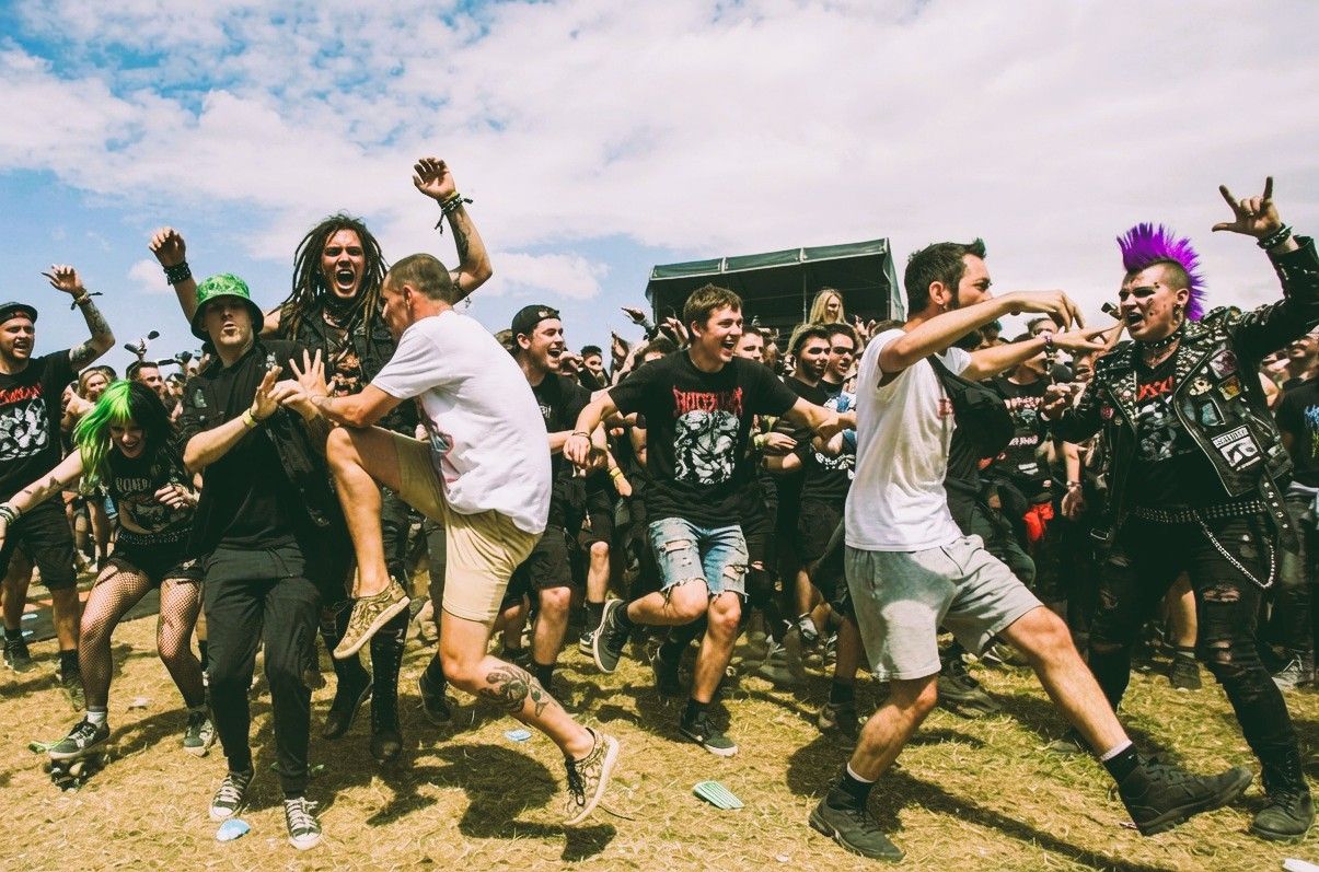 Festival-goers take part in a lively mosh pit at Download Festival 2026 in Donington Park.