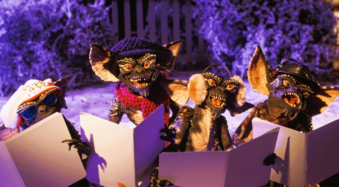 A group of mischievous Gremlins emerging from gift boxes, highlighting the franchise's unique blend of Christmas, comedy and horror.