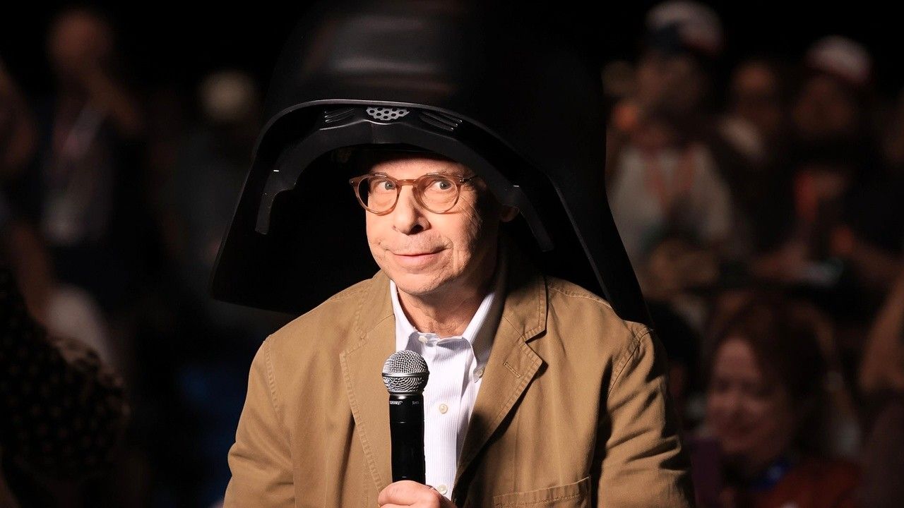 Rick Moranis makes an emotional return at the 2026 Spaceballs Comic-Con panel wearing Dark Helmet.