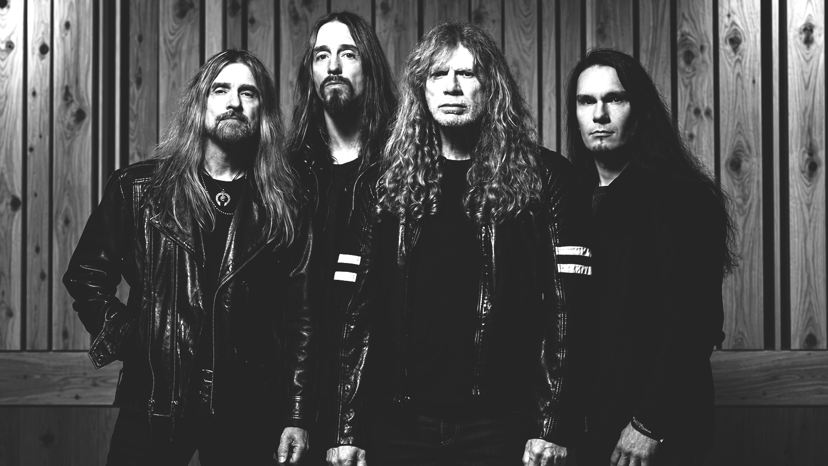 Megadeth's current lineup performing together during the band's farewell era in a black-and-white promotional photograph.