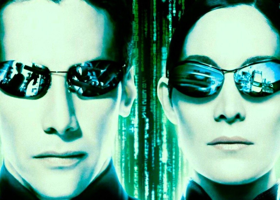 Neo and Trinity wearing sunglasses against the green digital code of The Matrix, representing the franchise's sequels.