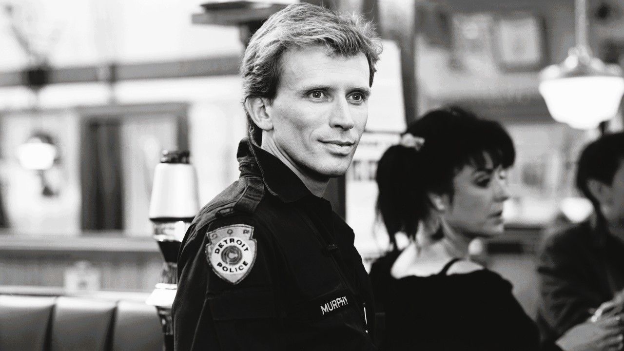 Peter Weller as Alex Murphy before becoming RoboCop, highlighting the humanity at the heart of the franchise.