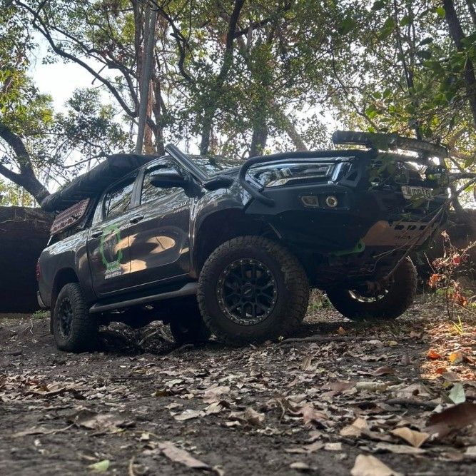 Black 4x4 Truck Off-roading in a Forest Setting — Mudpig Mechanical In Humpty Doo, NT