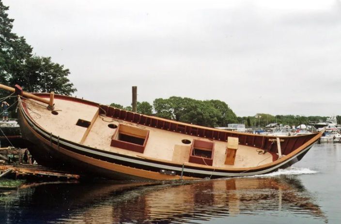 A boat is being launched into the water