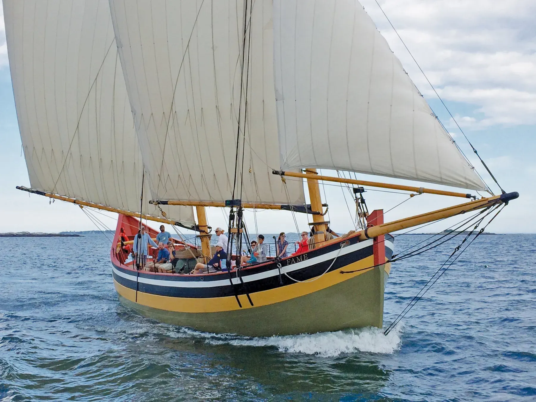 A sailboat is floating on top of a body of water.