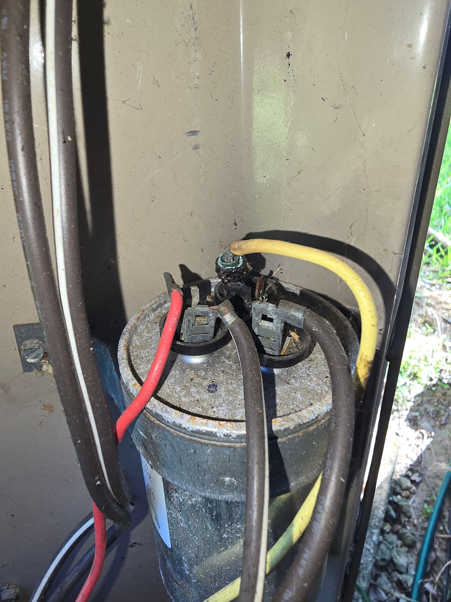 HVAC capacitor testing and replacement by Arnett Mechanical technician in Rosharon TX