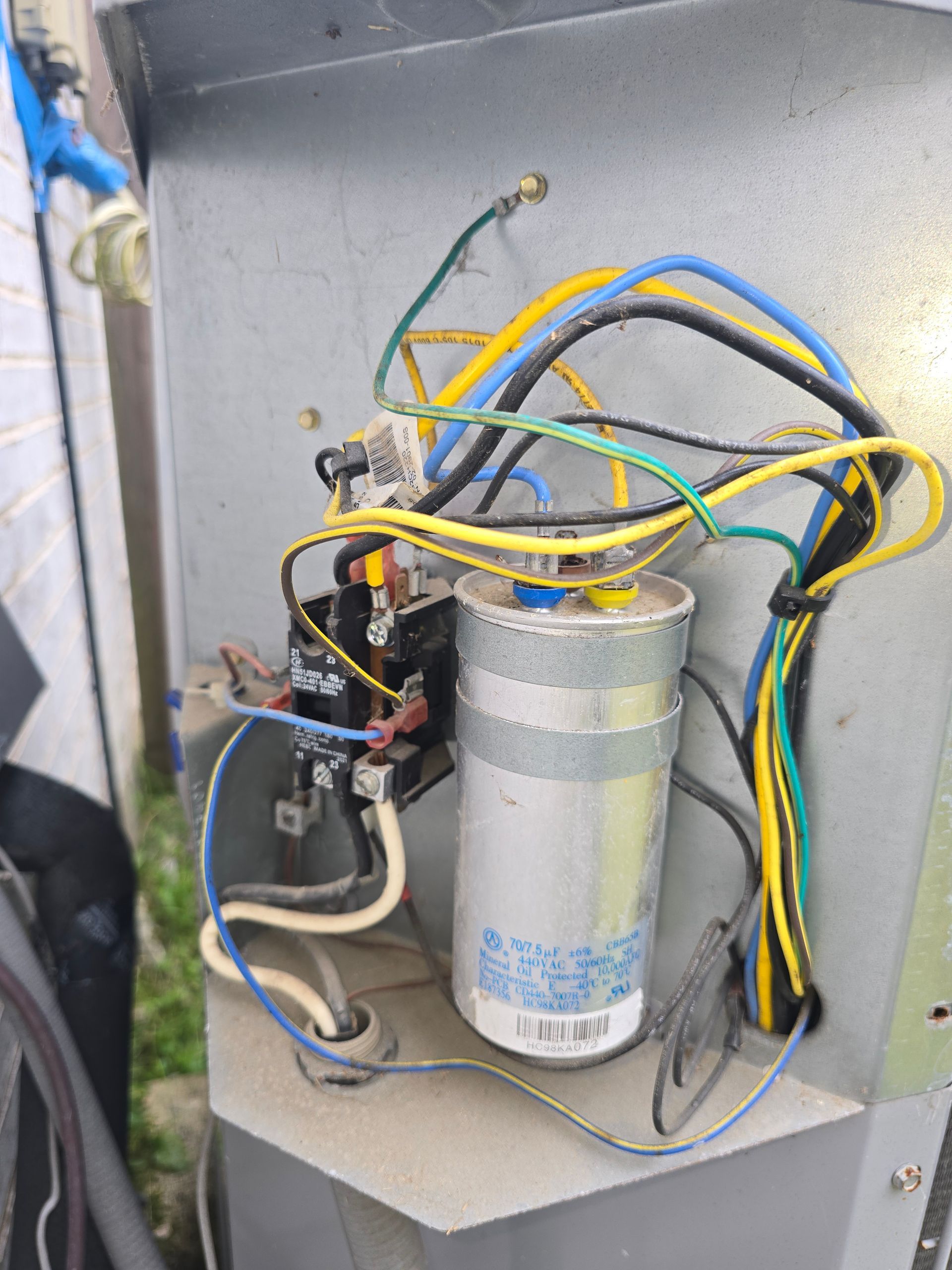 HVAC capacitor testing and replacement by Arnett Mechanical technician in Rosharon TX