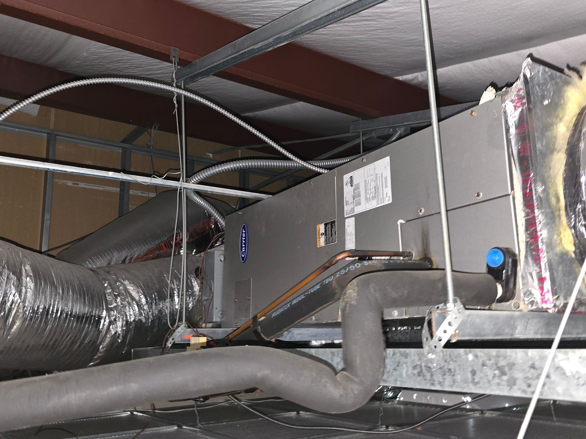 Outdoor AC units installed next to brick home by Arnett Mechanical in Rosharon TX