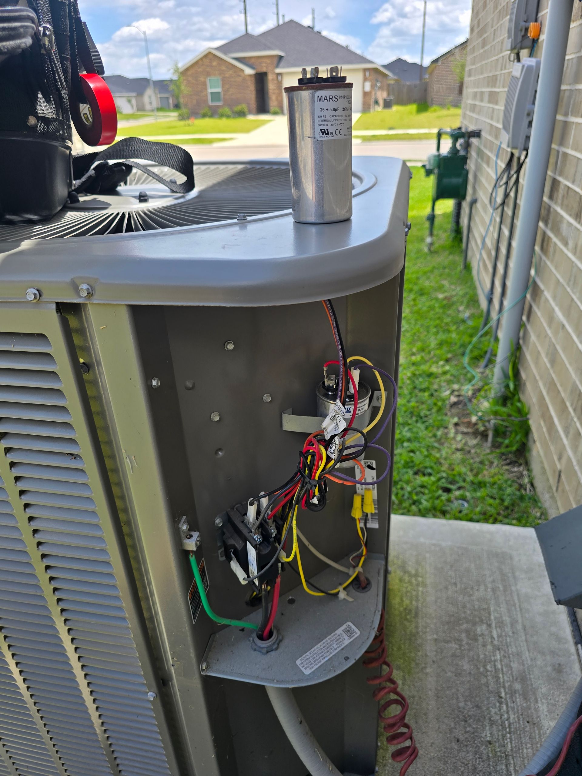 HVAC capacitor testing and replacement by Arnett Mechanical technician in Rosharon TX