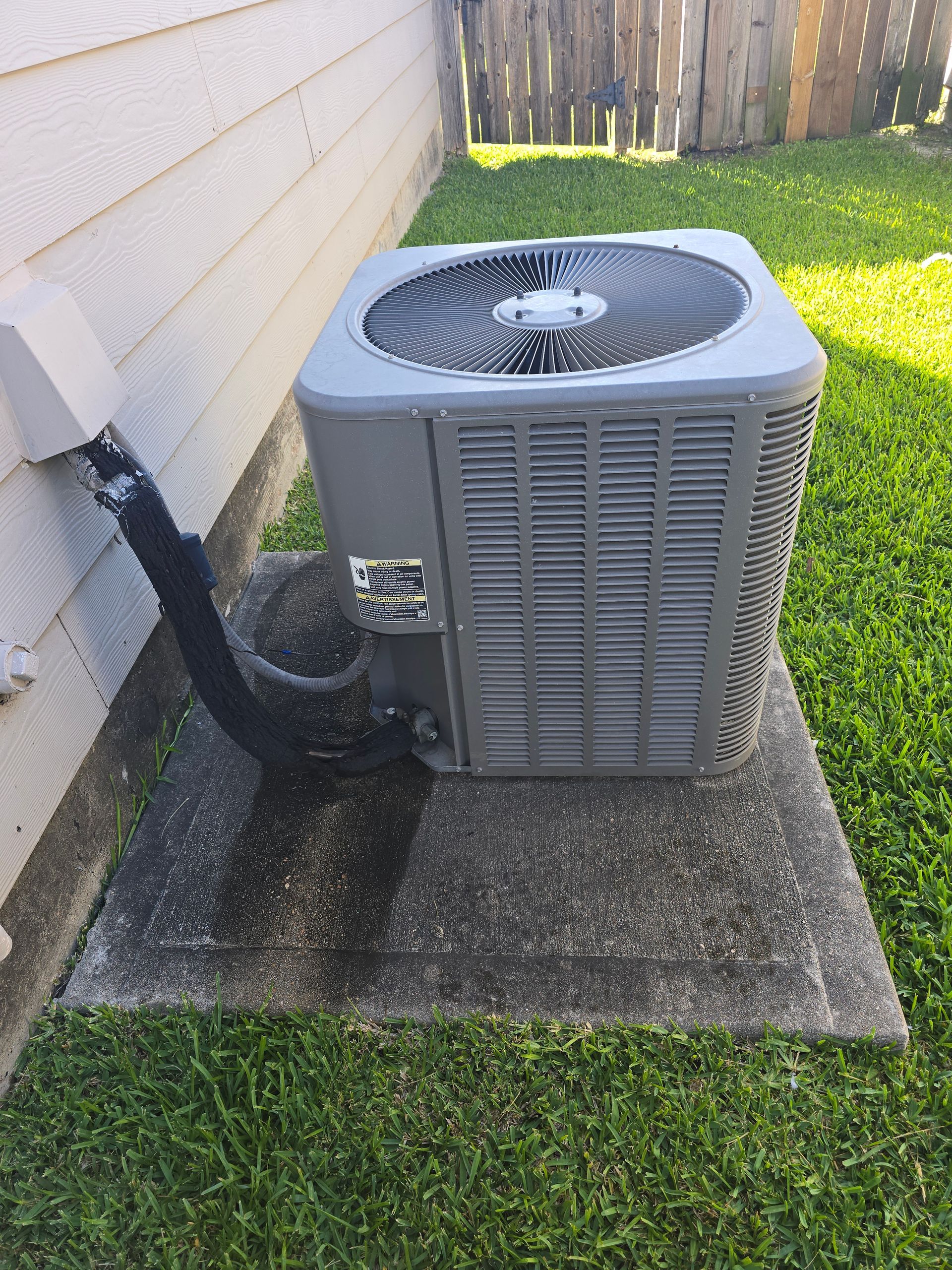 HVAC refrigerant gauges showing pressure readings during AC service by Arnett Mechanical