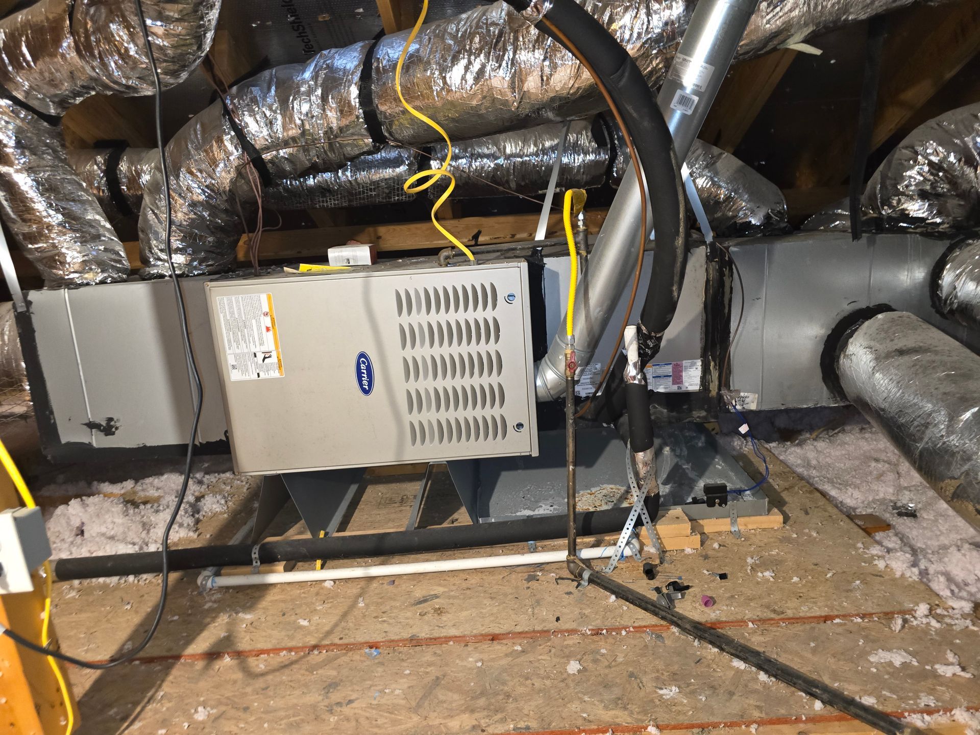 Outdoor AC units installed next to brick home by Arnett Mechanical in Rosharon TX