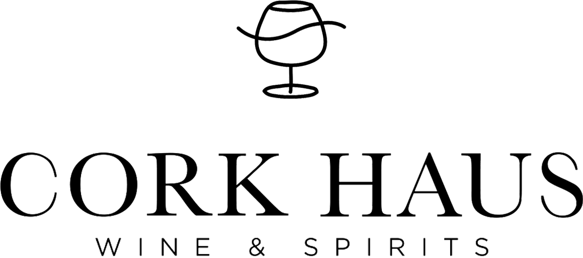 The logo for cork haus wine and spirits has a wine glass on it.