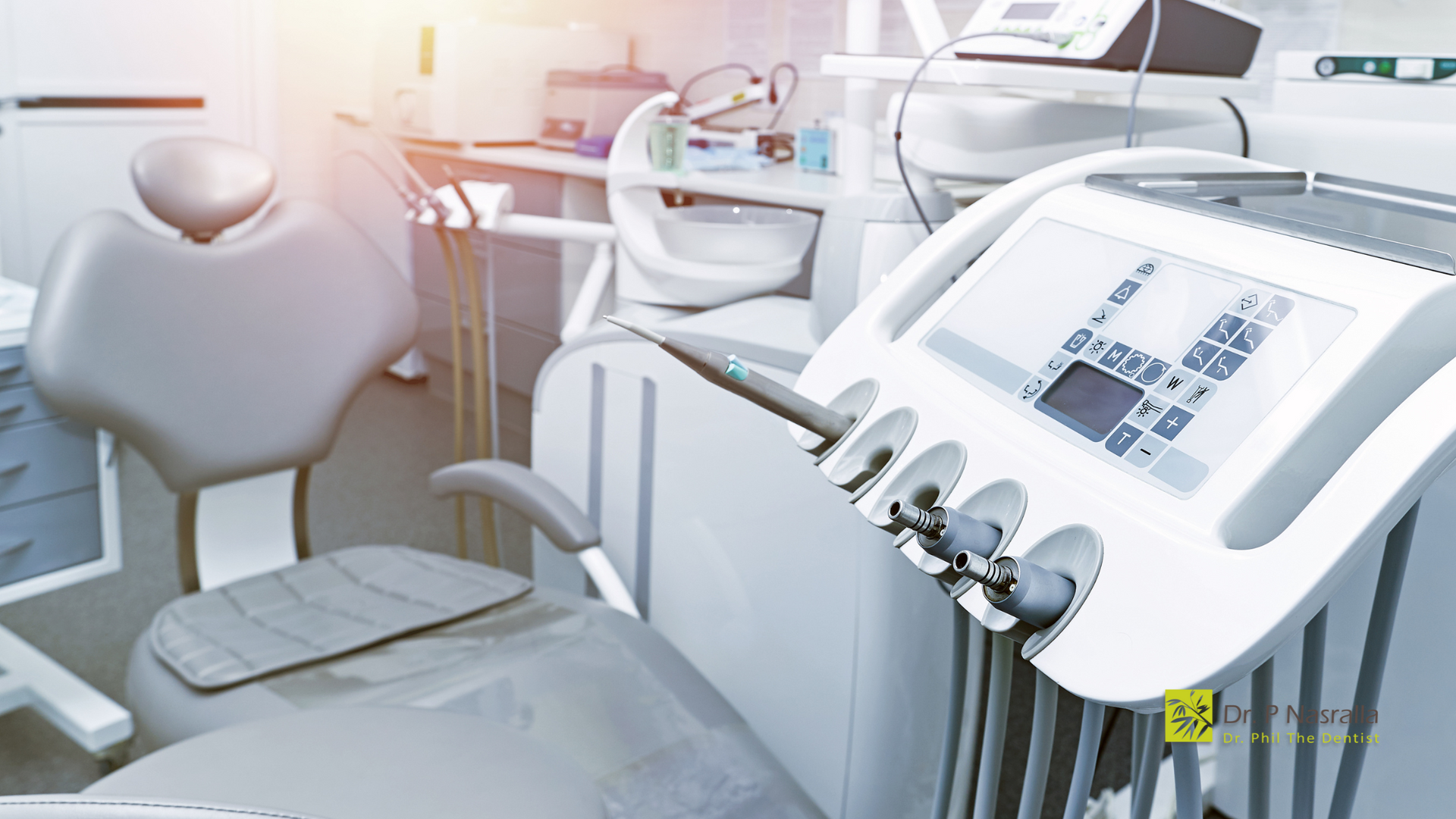 A dental office with a dental chair and a machine.