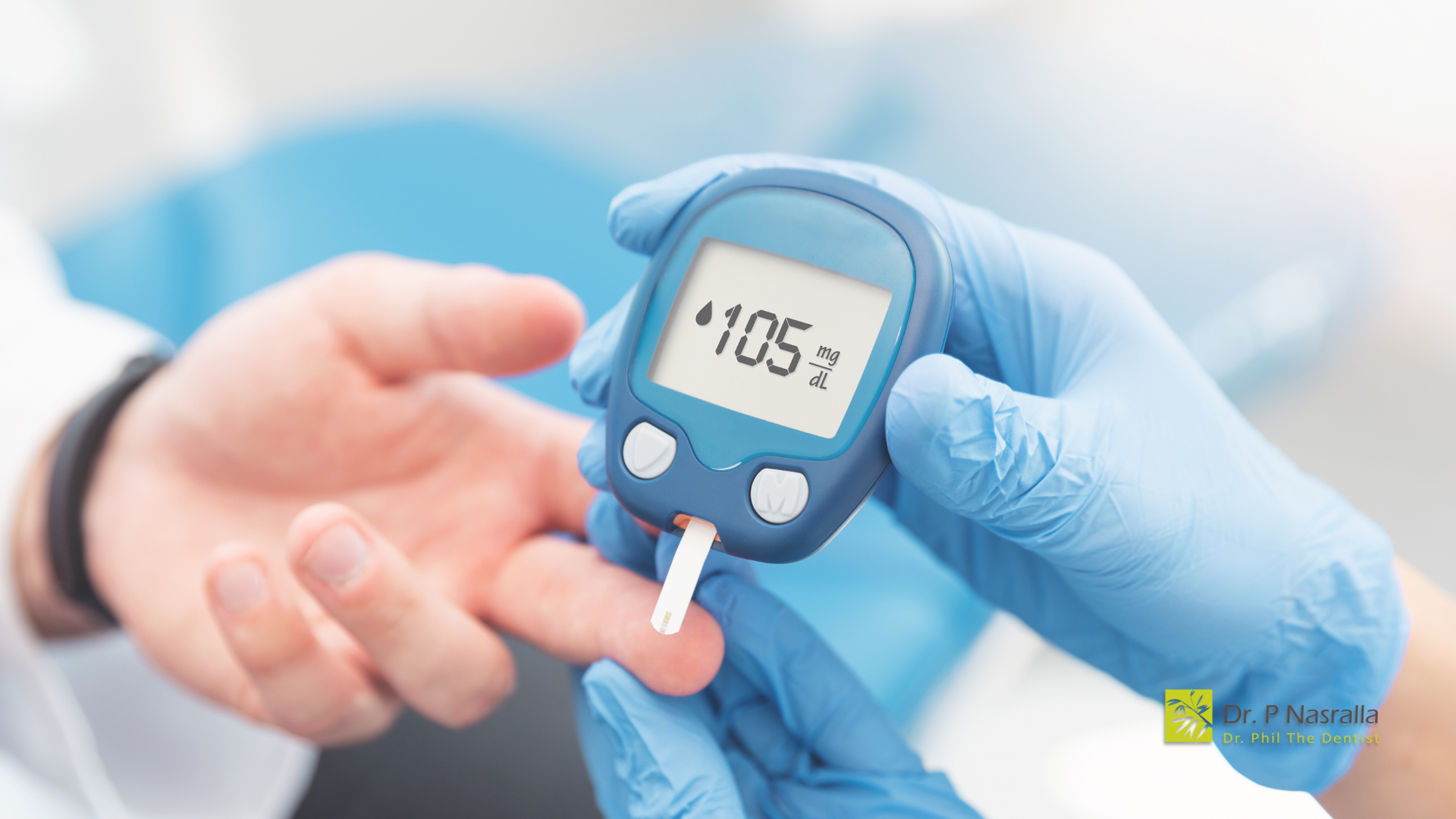 Person's finger being pricked with a lancet while blood glucose is tested by someone wearing blue medical gloves. Meter reads 105 mg/dL.