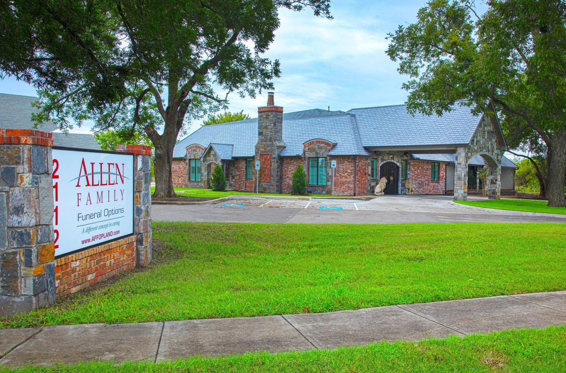 A brick building with a sign that says allen family