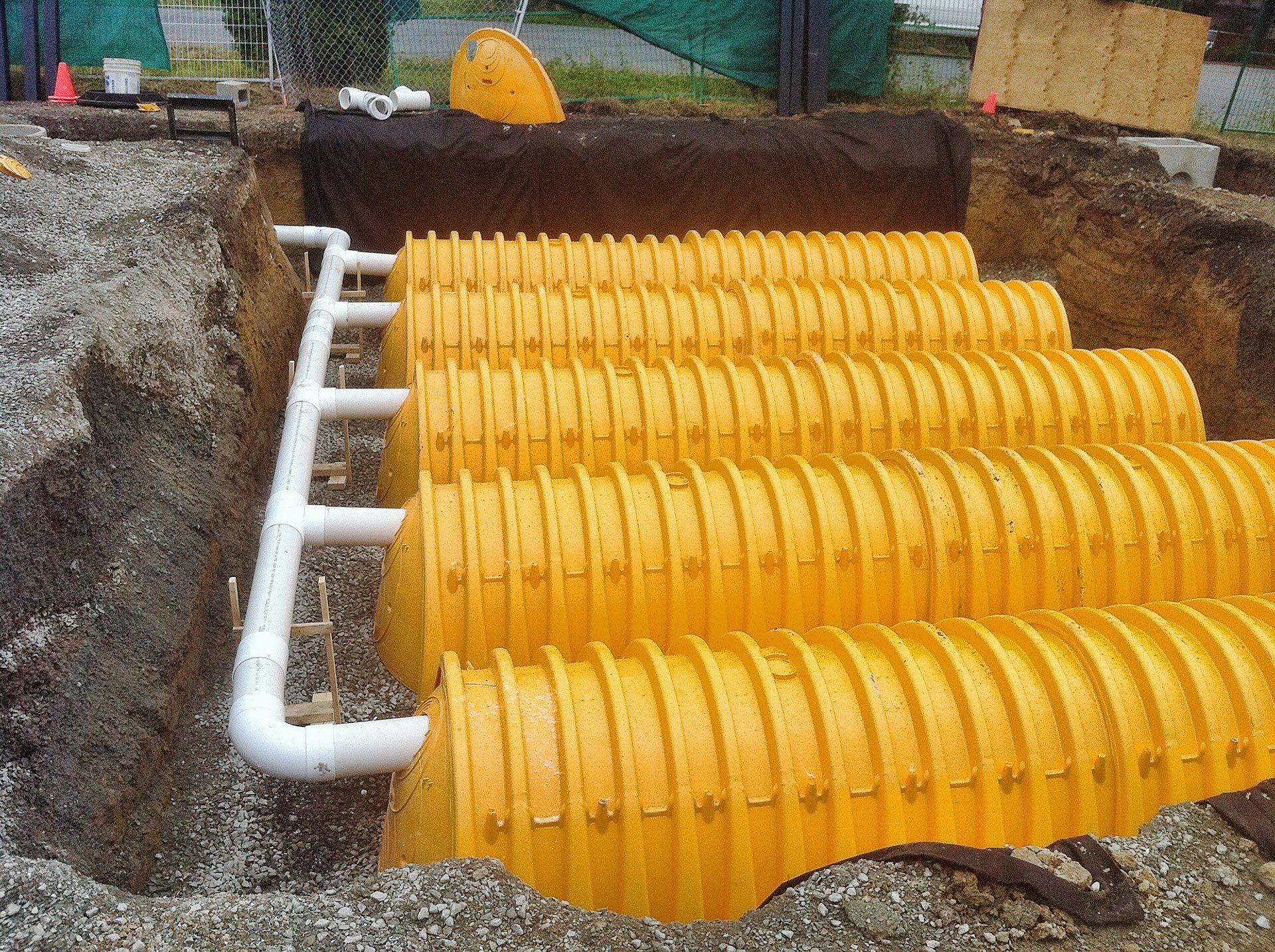 A large rainwater harvesting system installed in a wide trench