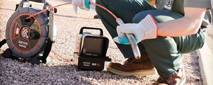 A drain scope with locator for diagnosing clogged drains