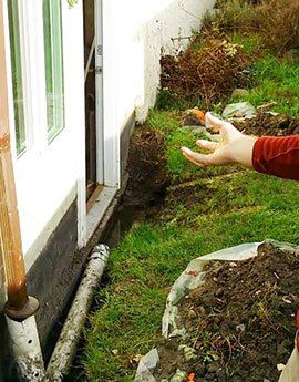 Pointing out drainage problems for Victoria BC customer