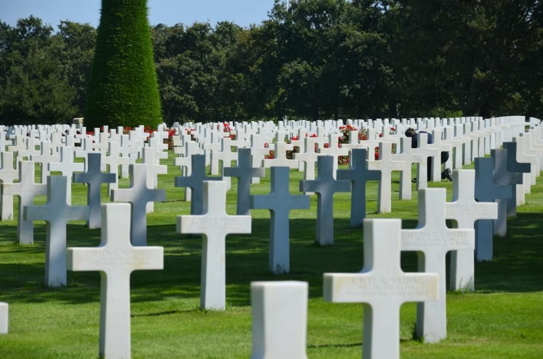 Rows of white crosses in cemetery, funeral home and cremations Albuquerque, NM