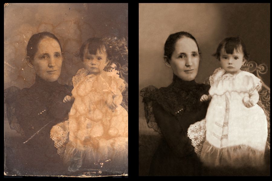 A woman is holding a baby in her arms in a black and white photo.