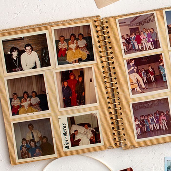A photo album is open to a page that says mini-mates