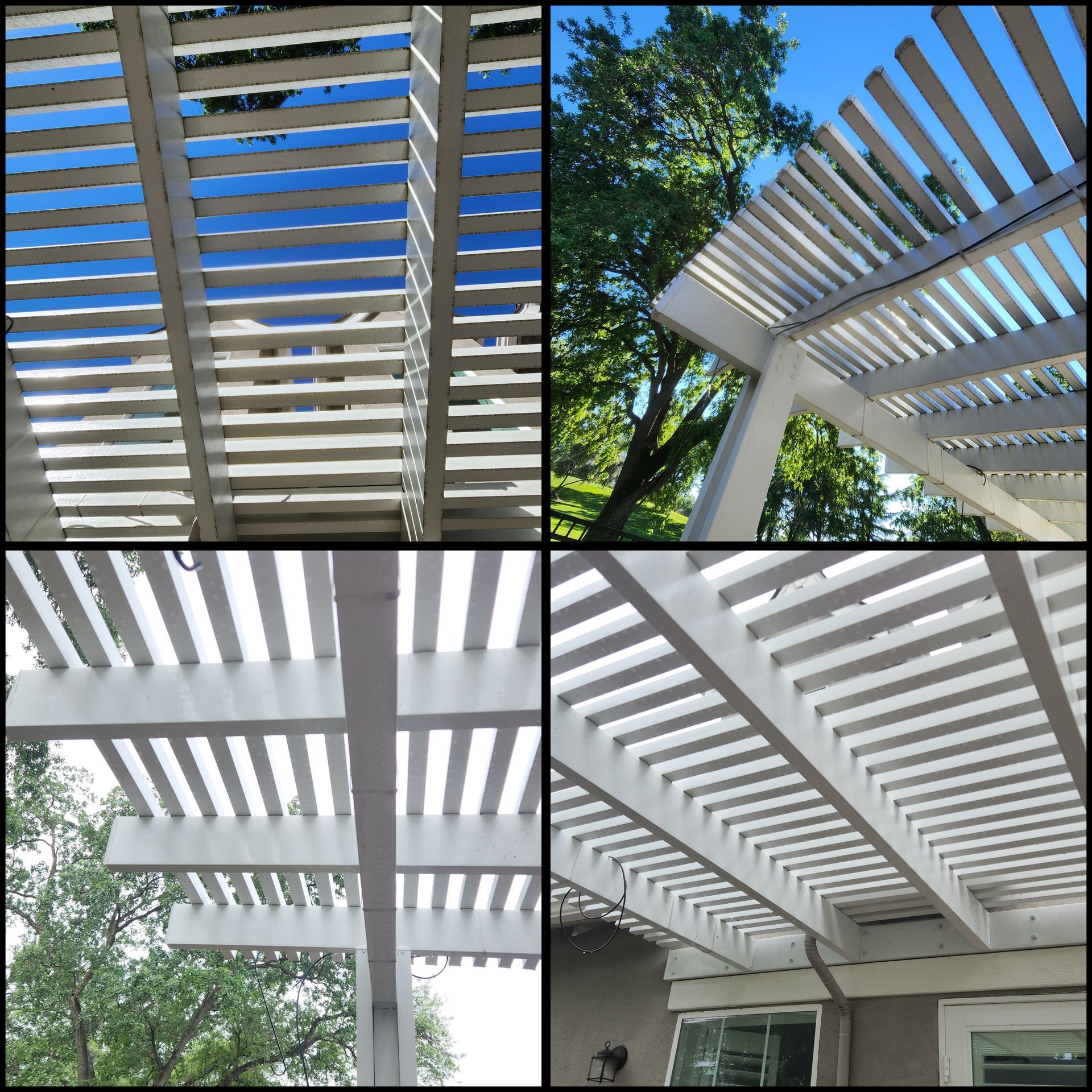 White slatted pergola roof with beams overhead, shown from below against blue sky and trees.