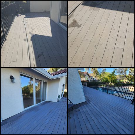 Wooden deck patio with white house exterior, sliding glass doors, and railing in bright sunlight