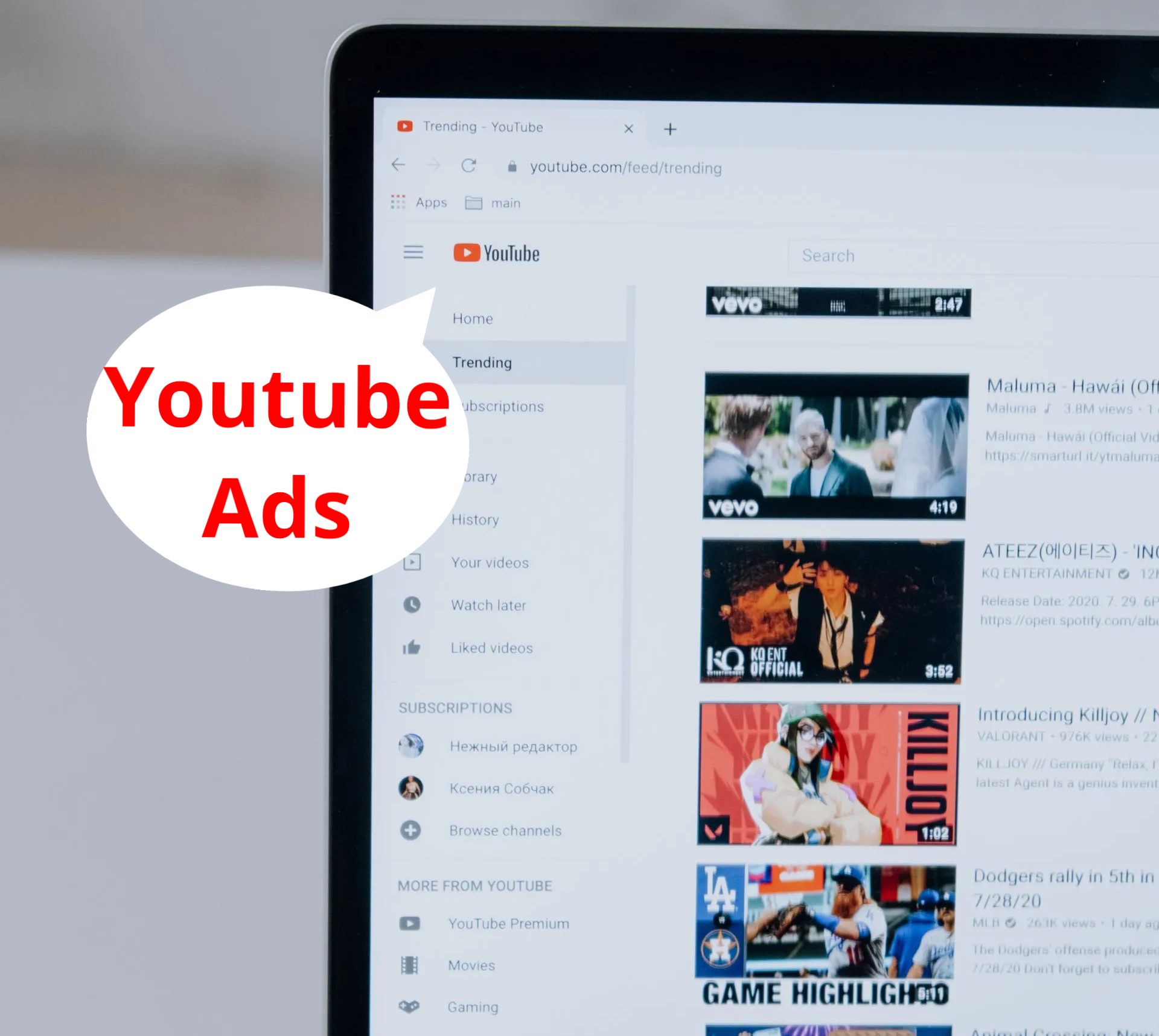 A laptop is open to a youtube ads page