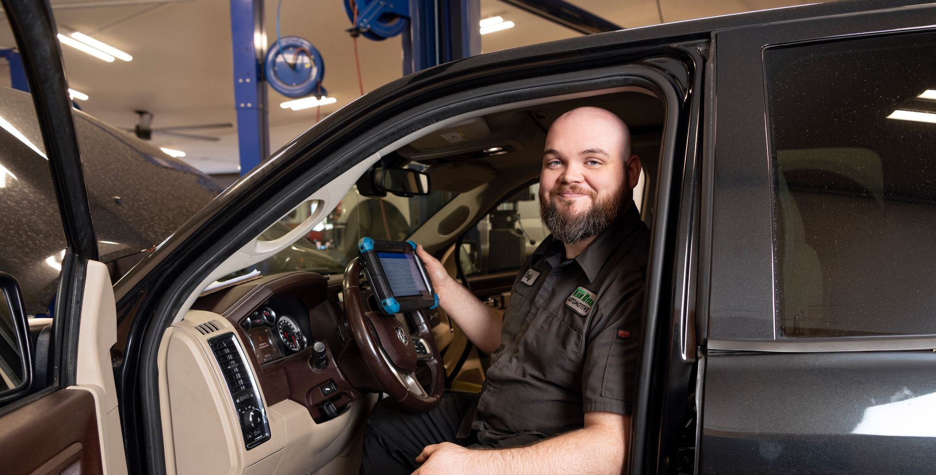 Team Ryan Automotive technician performing vehicle diagnostics