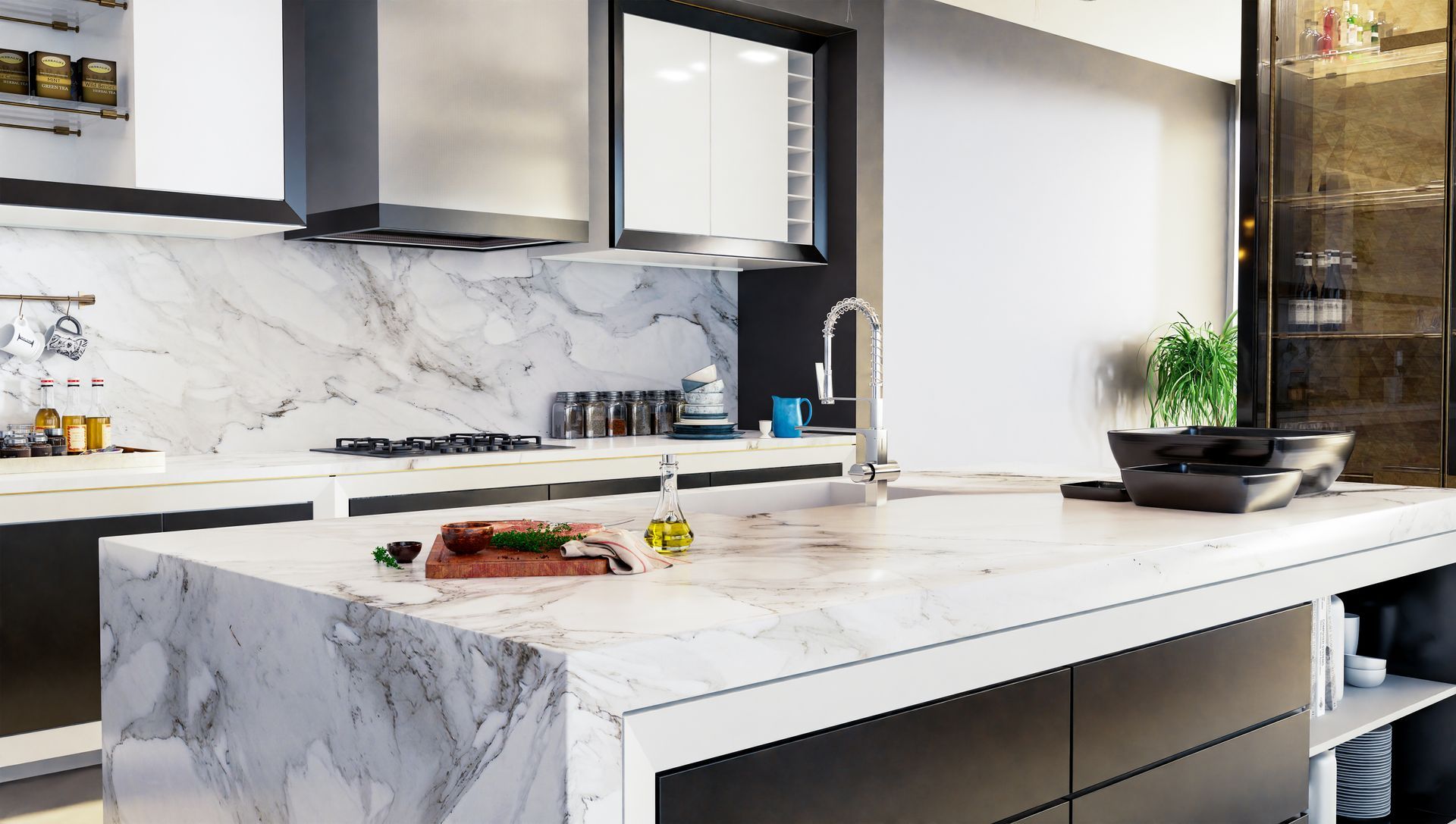 Modern kitchen with white marble island, dark cabinets, and a bowl on the countertop.