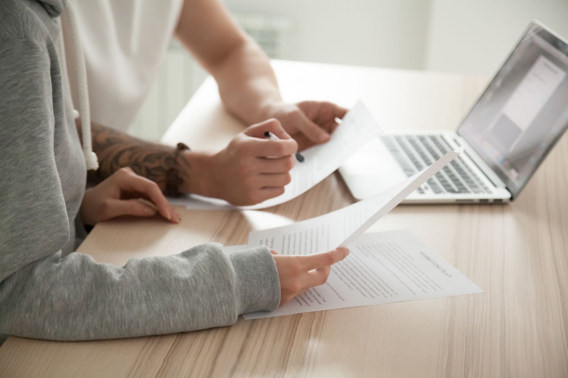 people reviewing insurance papers