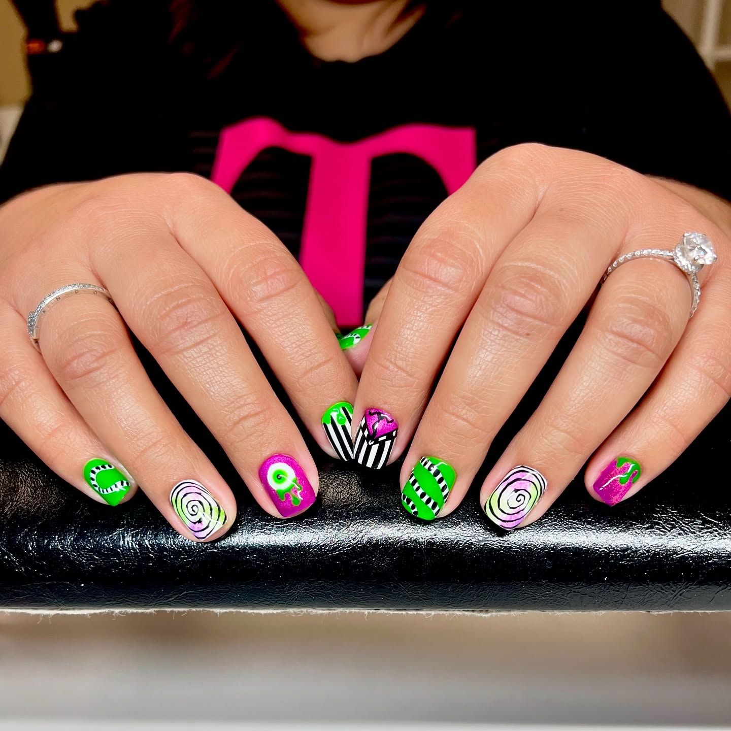 A woman wearing a t-mobile shirt has a ring on her finger