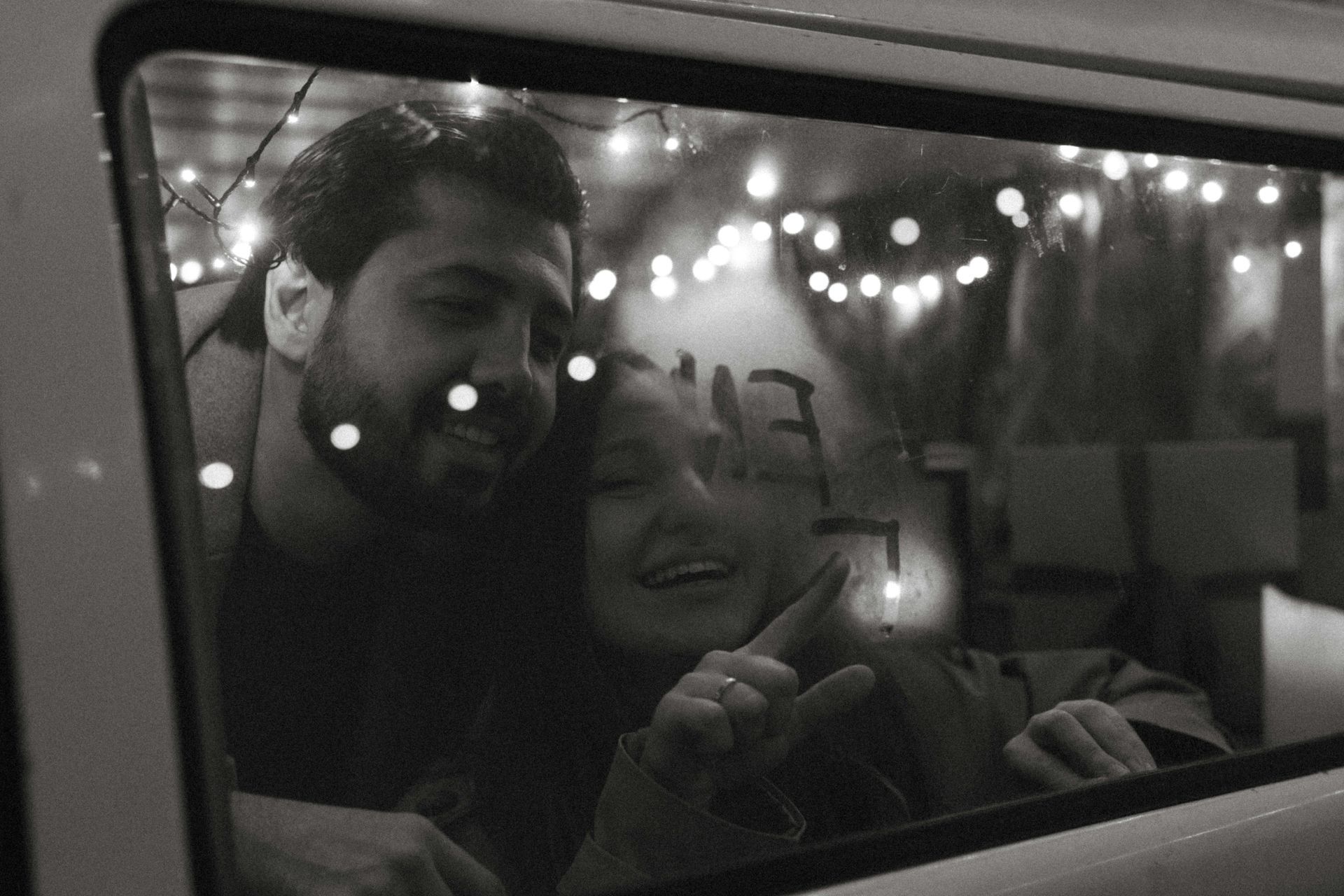 Couple looking out the window and writing cold window. HunnyDo's Date Planning Blog: Don't hibernate, hunny.