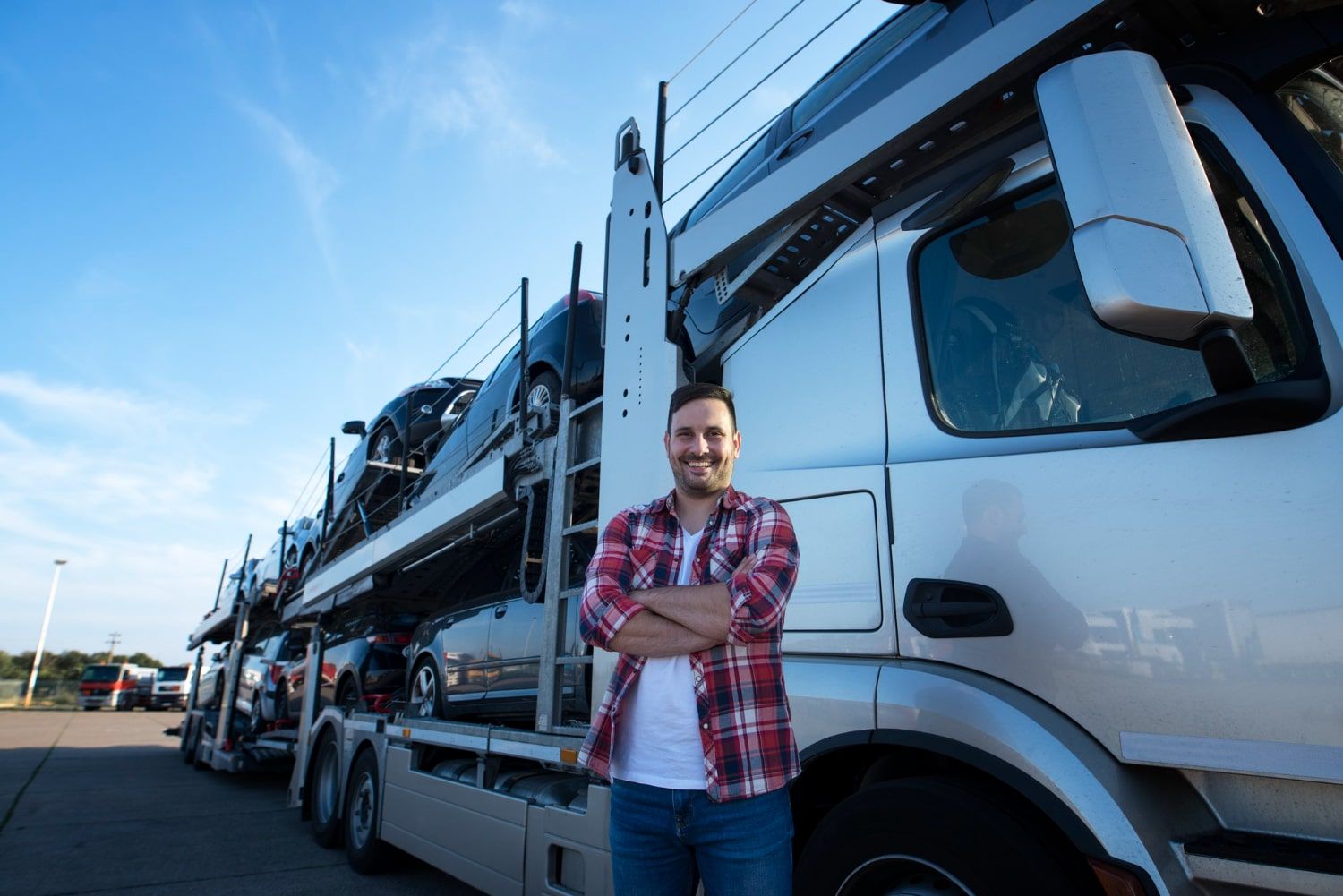 man next to truck, ready for car shipping