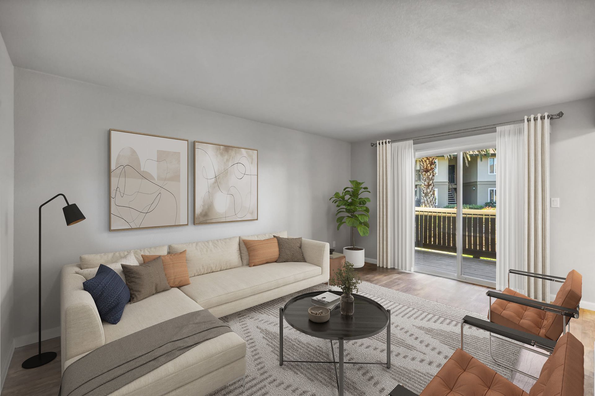 Living room with beige sectional sofa, throw pillows, and sliding glass doors to a balcony at Villa Palms Apartments.