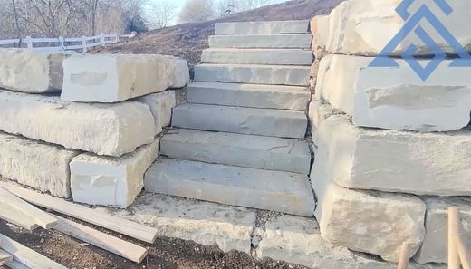 Retaining Walls A set of stairs built into a stone wall.