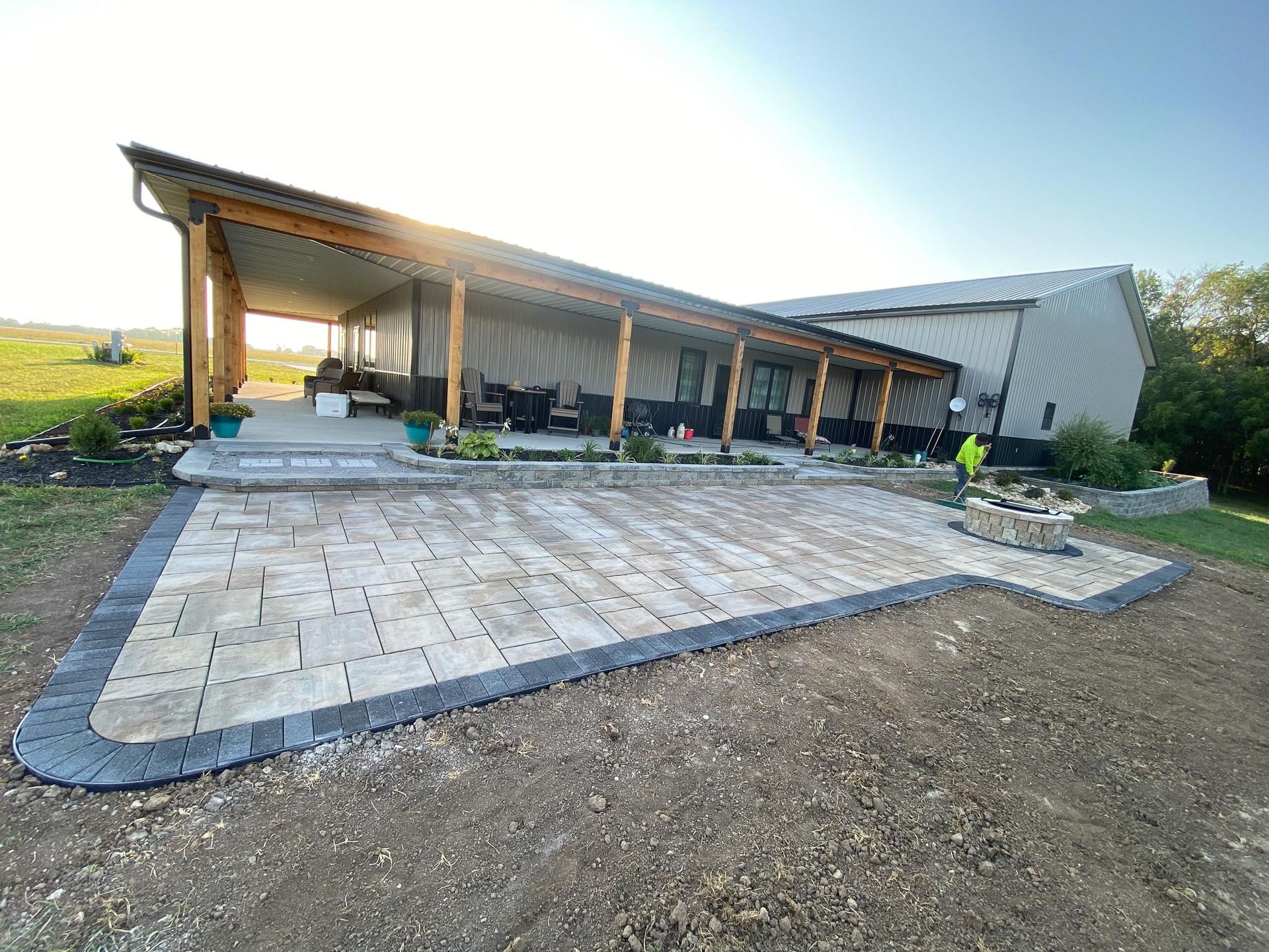A large house with a large patio in front of it.
